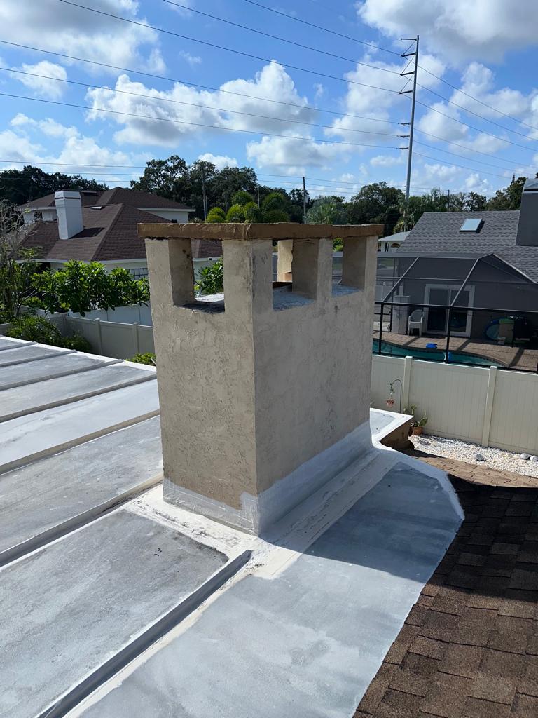 Brick chimney crown rebuild and stainless cap installation in Maryland by Eagle Chimney Service
