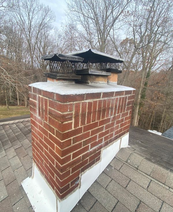 Emergency chimney flashing leak repair with ice-and-water shield in Maryland